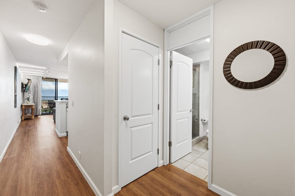 Welcoming entry hallway leading into the open living and dining space.