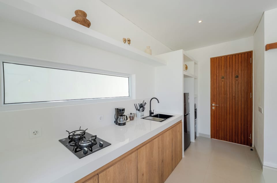 Fridge, coffee/tea maker, paper towels, kitchen islands