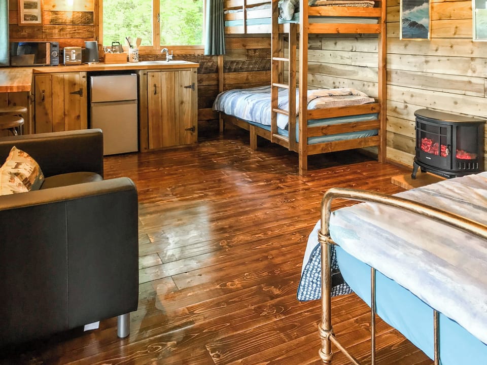 Open plan living space | Fisherman&rsquo;s Cabin - Wild Meadow Camping, Plwmp