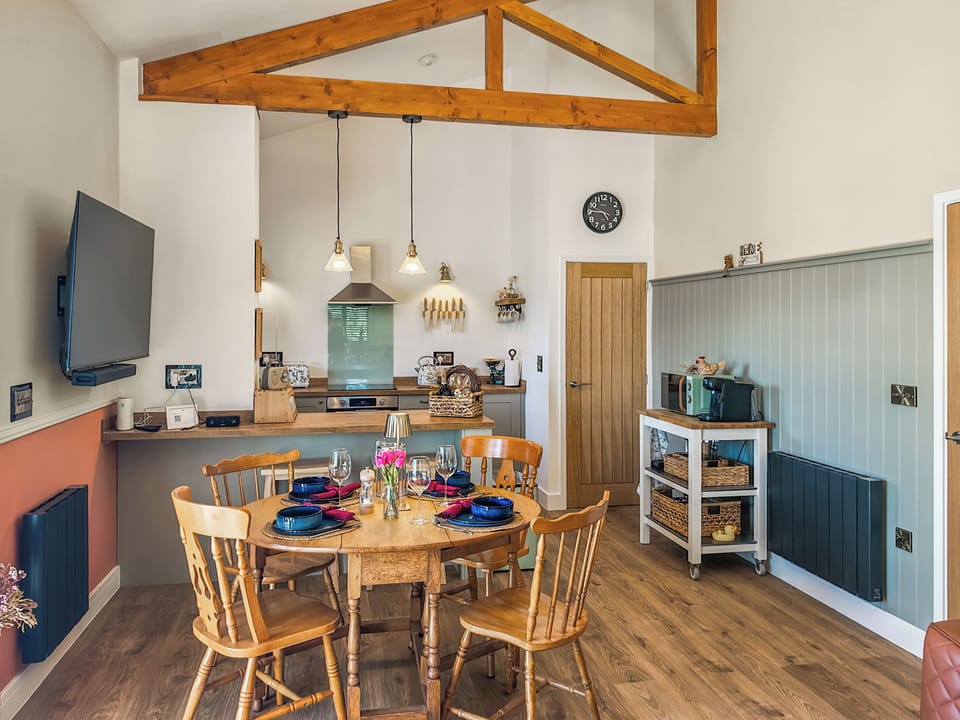 Kitchen, breakfast bar, dining area | Humble Bee Cottage, Llanarth, near New Quay