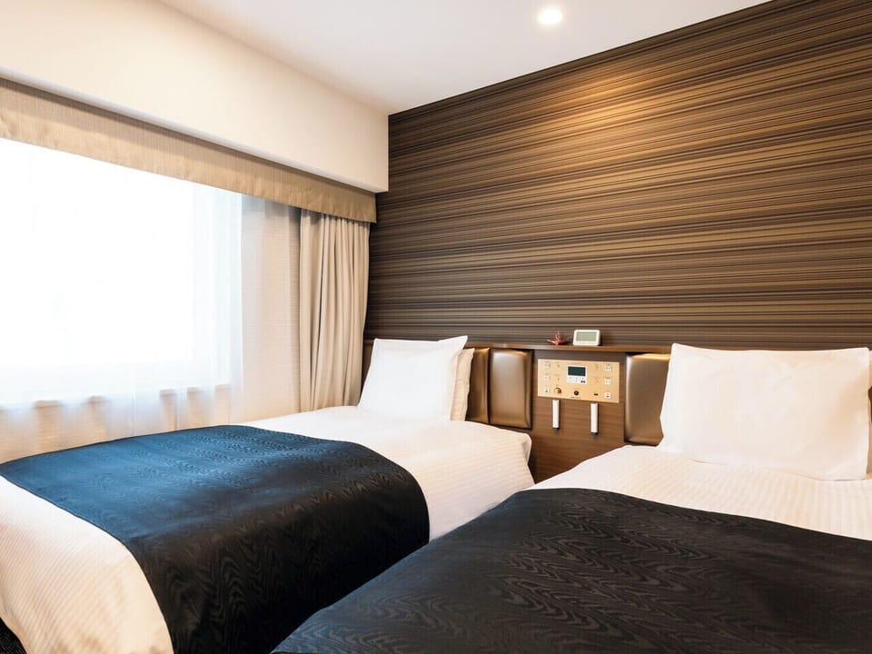 Twin Room, Non Smoking | Down comforters, desk, blackout drapes, WiFi (free)