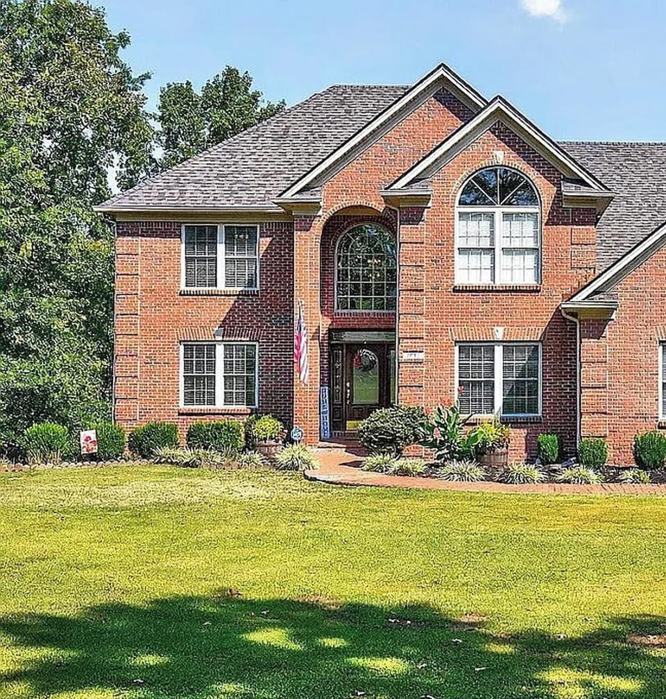 Grand brick home set on a quiet, private lot.