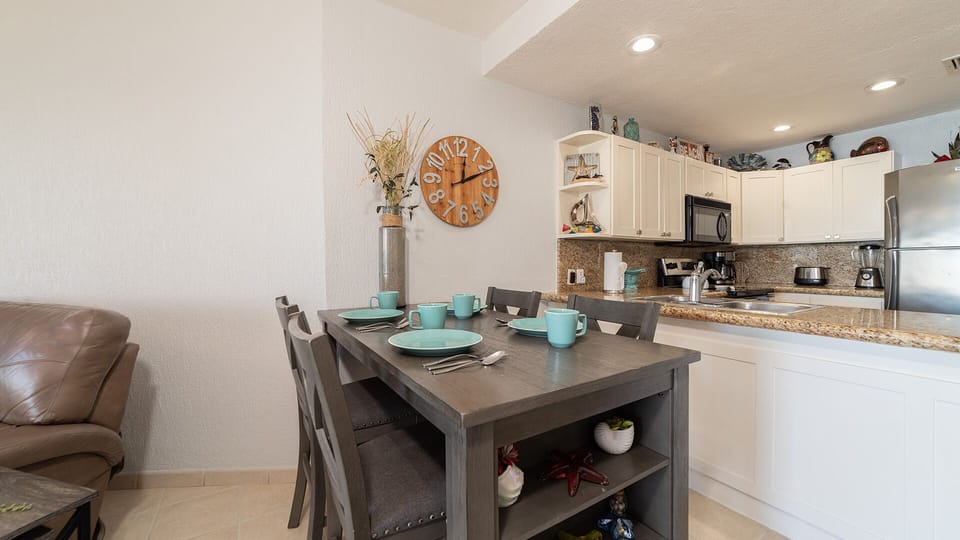 Dining table and kitchen.