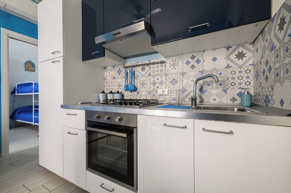Apartment (1 Bedroom) | Private kitchen | Oven, stovetop, electric kettle, cookware/dishes/utensils