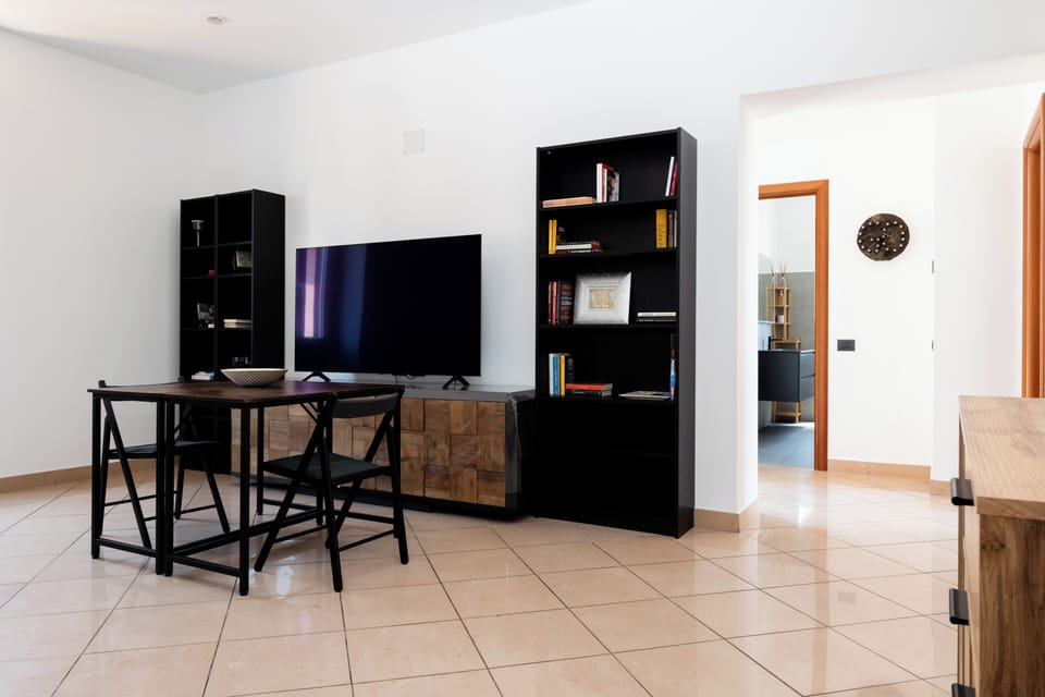 Apartment (1 Bedroom) | Living area | 32-inch Smart TV with cable channels