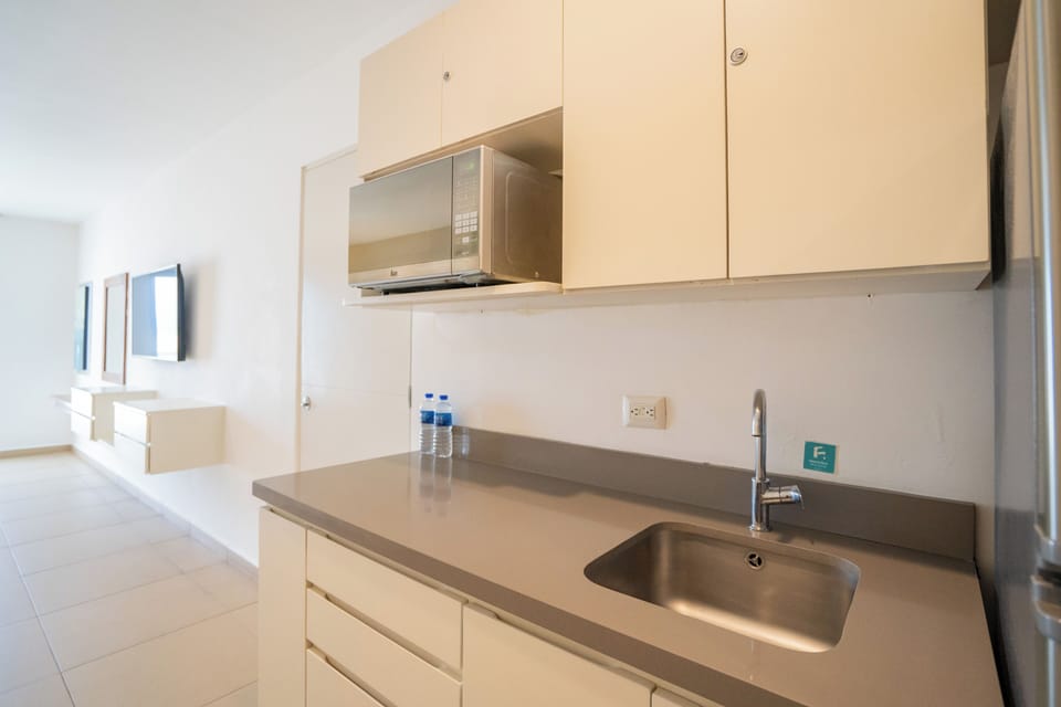 Junior Suite (No View) | In-room safe, desk, laptop workspace, blackout drapes
