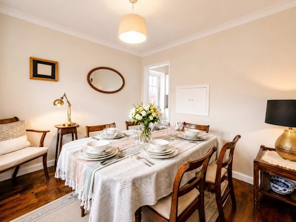 Dining Room: Dine in style beneath elegant lighting, surrounded by charming decor and warm hues!