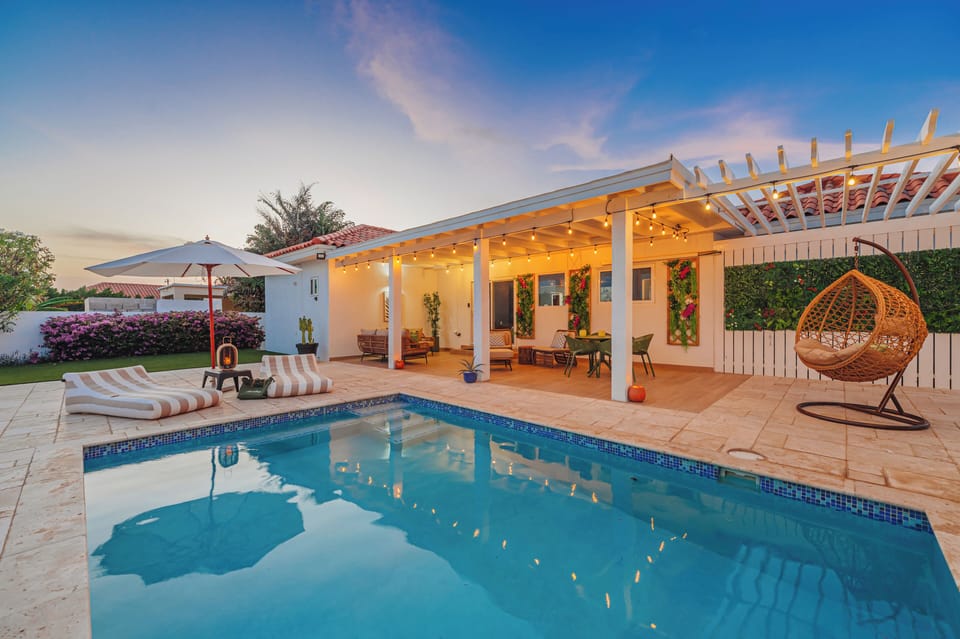 Evening ambiance with warm lighting and a fully covered patio