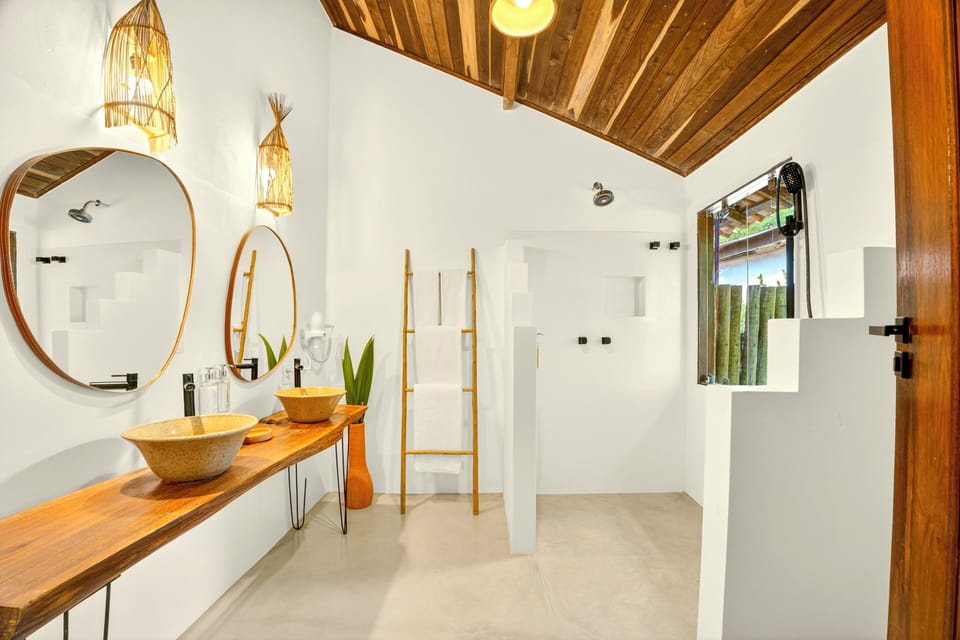 Deluxe Quadruple Room, Garden View | Bathroom | Shower, hair dryer, towels, soap
