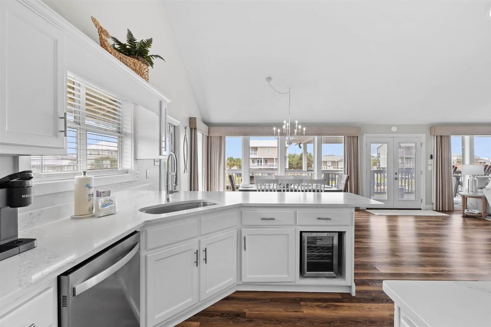Cook with stunning views in your spacious kitchen featuring modern appliances and an open layout that flows to the dining and living areas.