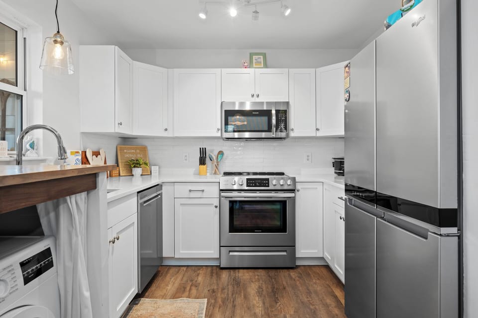 Your bright, fully-equipped kitchen welcomes you with modern appliances and ample counter space for preparing memorable meals together.