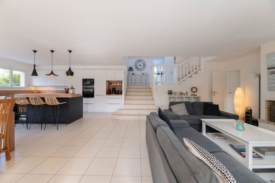 Relax in the spacious, sunlit living area, designed for comfort and connection.