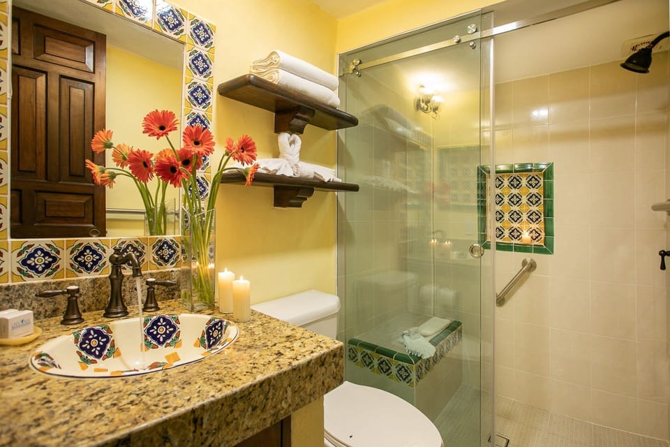 The elegant bathroom showcases stunning handcrafted tiles and modern fixtures, featuring a refreshing space for relaxation after a long day.