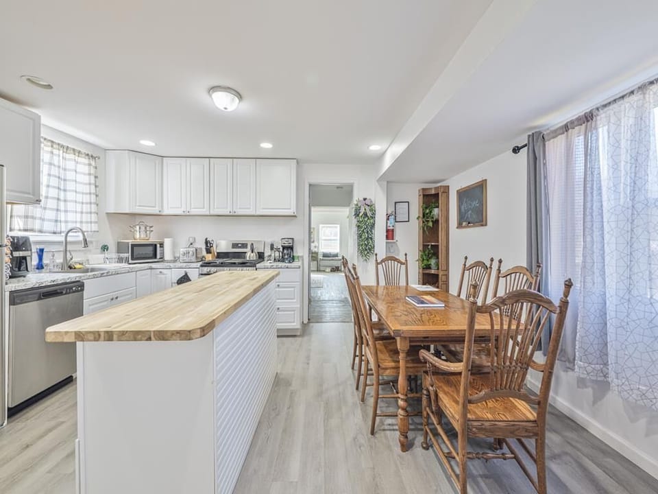 A fully equipped kitchen with everything you need — stainless appliances, a large island, and natural light to make cooking feel effortless.