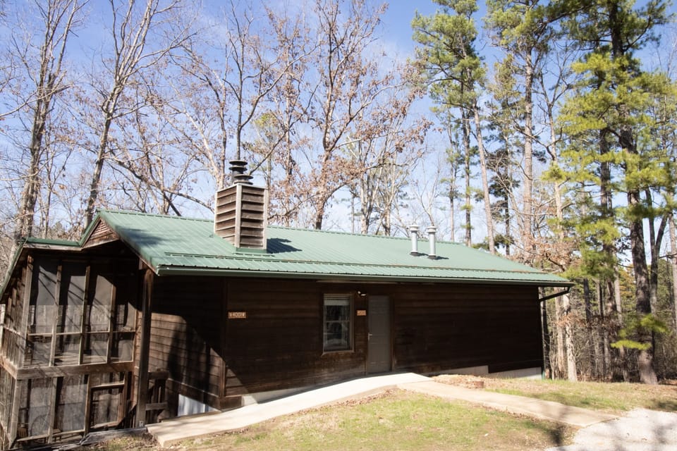 Nestled among tall trees, this cabin invites you to enjoy nature just steps away.