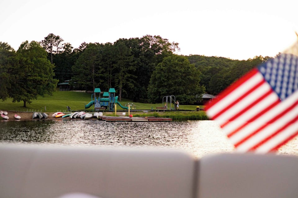 A serene lakeside moment, complete with patriotic charm and stunning reflections.