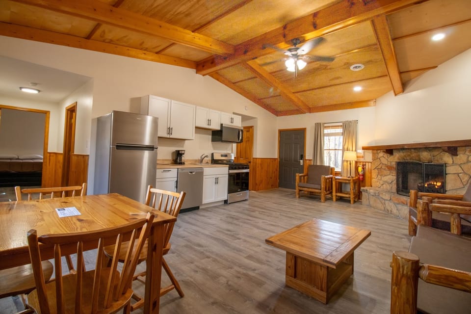 Gather around the rustic dining table after cooking in your fully equipped kitchen.