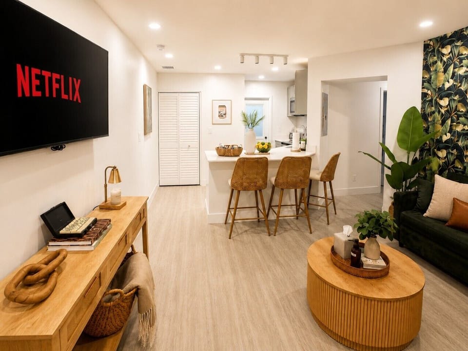 Open-concept living and dining area with boutique Cuban-inspired décor and comfortable seating.