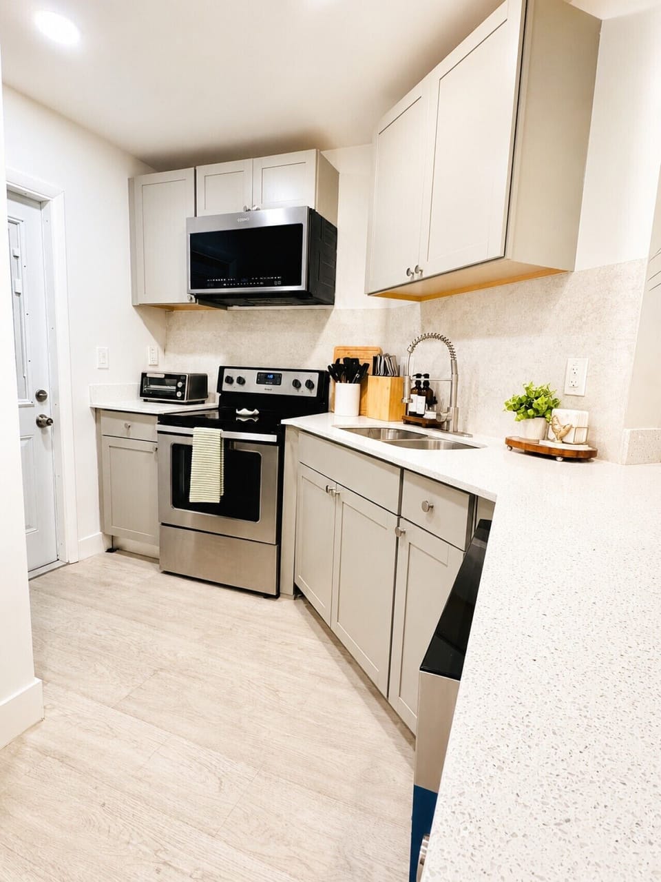 Modern kitchen with cookware, dinnerware, and essentials for every stay.