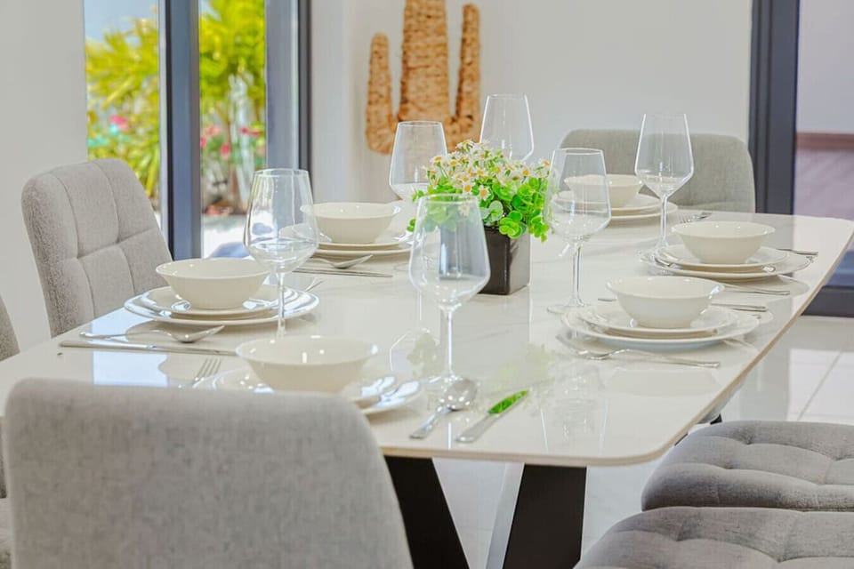 Beautifully set dining table for 6 with stylish tableware—perfect for enjoying meals in a clean, modern setting.