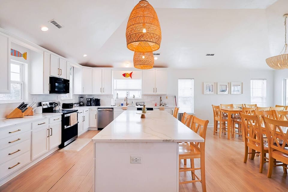 Fully equipped kitchen with oversized island and bar seating—ideal for cooking, hosting, and staying connected.