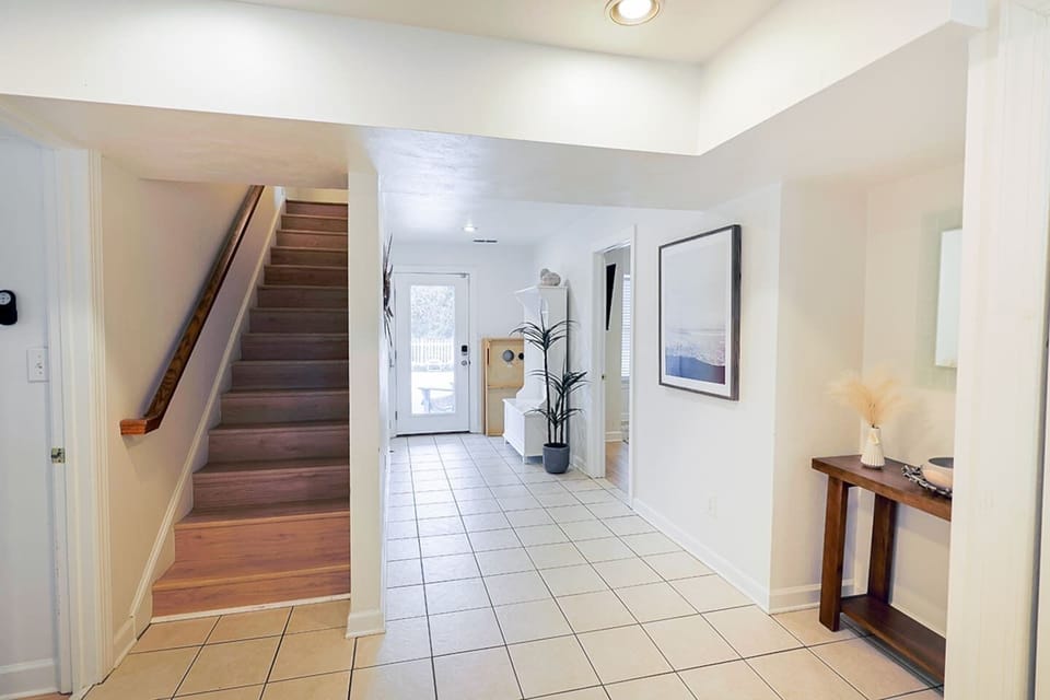 Wide, open hallway with thoughtful décor and easy access to multiple rooms—designed for comfort and convenience.