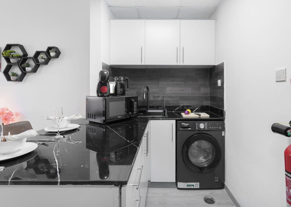 Luxury Studio, Balcony, City View | Private kitchen | Full-size fridge, microwave, oven, stovetop