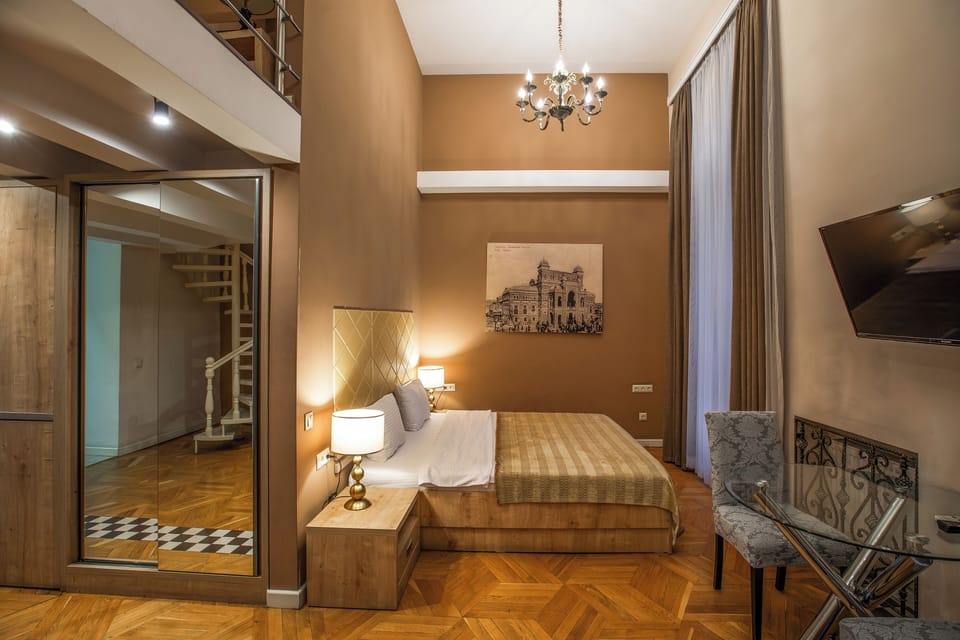 Family Apartment, Balcony, City View | In-room safe, desk, soundproofing, iron/ironing board