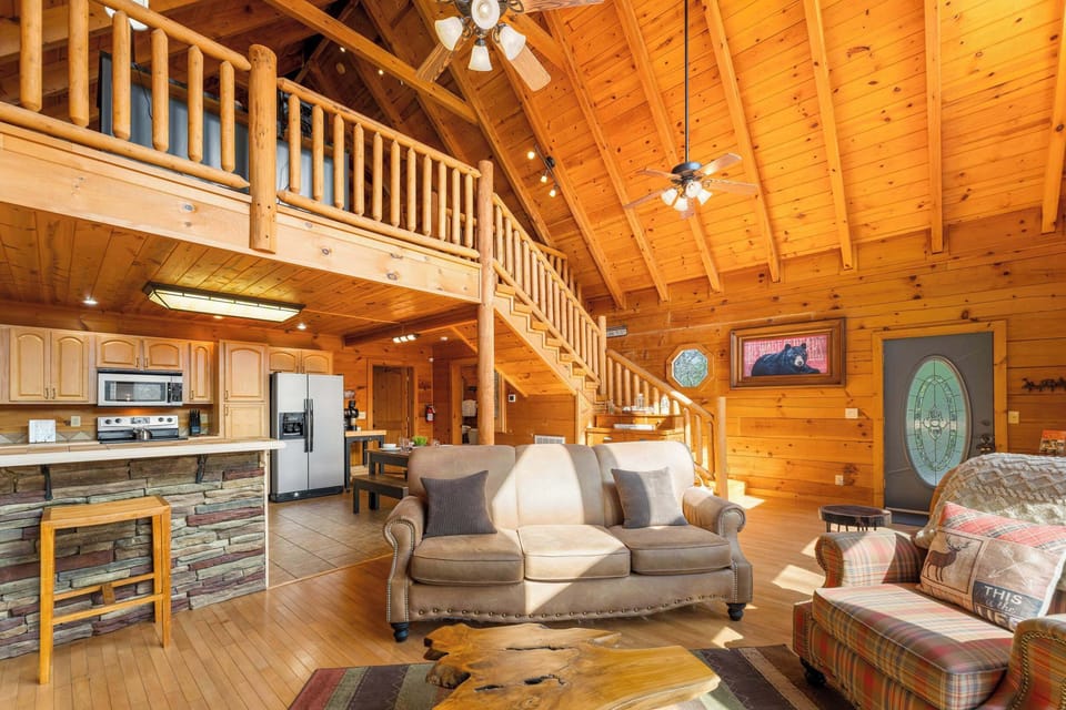 Cozy living room w/ smart TV, electric fireplace, and deck access