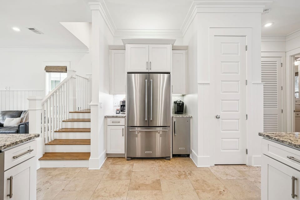 Step into your gourmet kitchen where stainless steel appliances and granite countertops create the perfect space for preparing memorable meals.