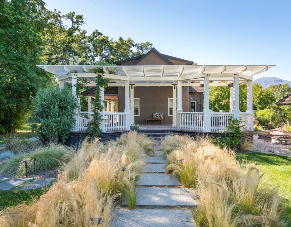 Charming wine country retreat with a welcoming pergola porch - arrive, unwind, and soak in the peaceful beauty of your private Calistoga escape.