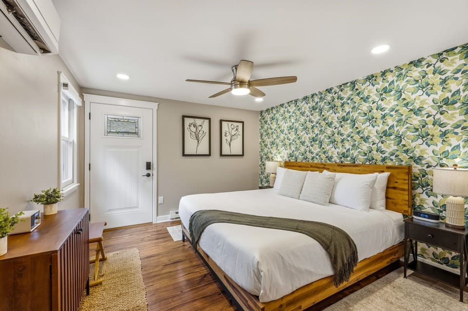 A perfect, peaceful retreat to relax and recharge in a plush king-size bed, surrounded by warm wood accents, soft lighting, and cozy cabin charm.