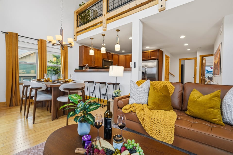 The open-concept layout flows effortlessly into a welcoming dining area and a beautifully appointed kitchen