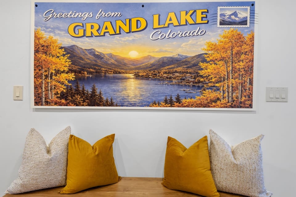 This charming nook just off the kitchen is adorned with postcard-inspired art and invites you to settle in and begin your stay at Mountain Magic in beautiful Grand Lake.