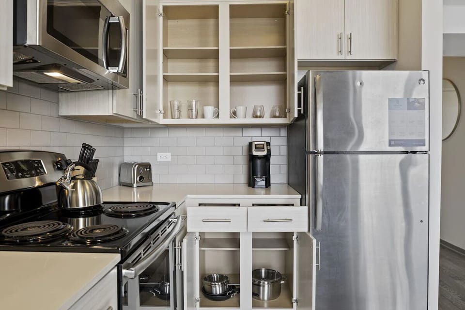 Start mornings with coffee and plenty of organized cabinet space.