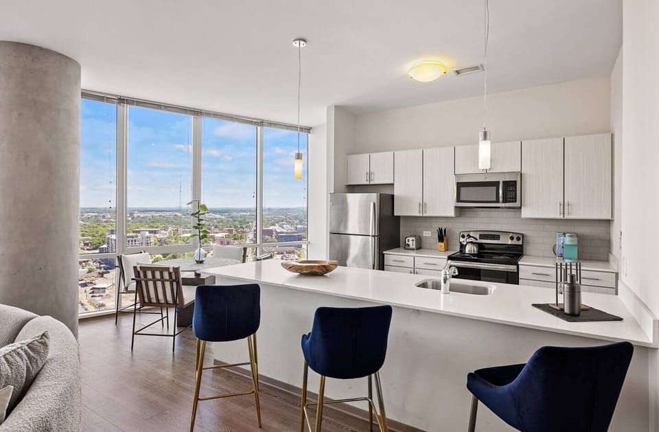 Sip morning coffee at the bar with panoramic city scenery.