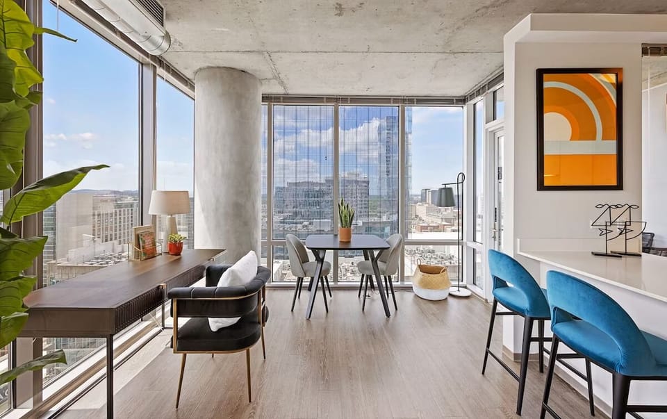 Unwind in a sunlit lounge with sweeping skyline views.