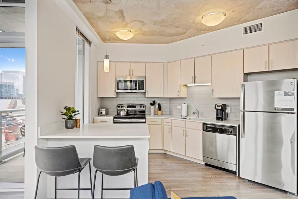Whip up breakfast in the sleek, sunlit full kitchen.