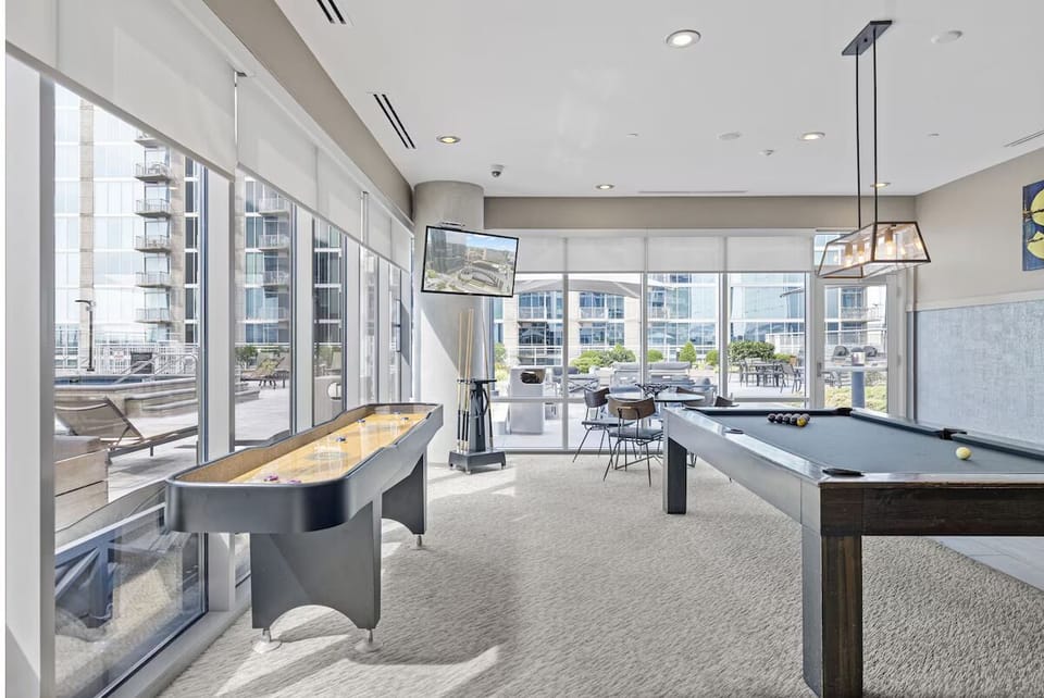 Challenge friends to shuffleboard in this light-filled lounge.
