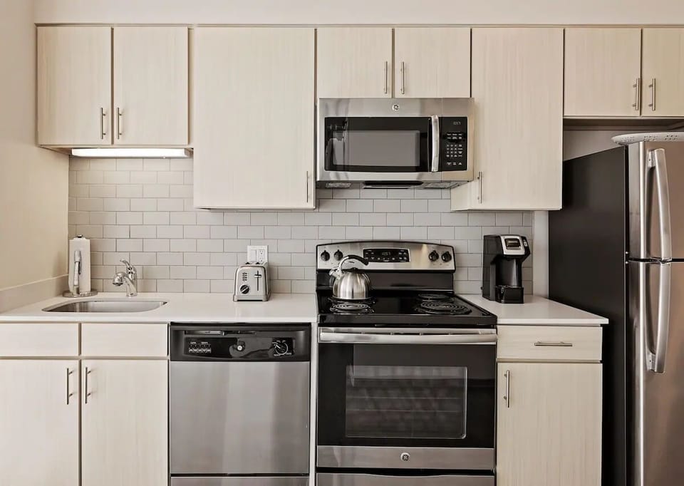 Prep meals effortlessly on sleek counters under bright task lighting.