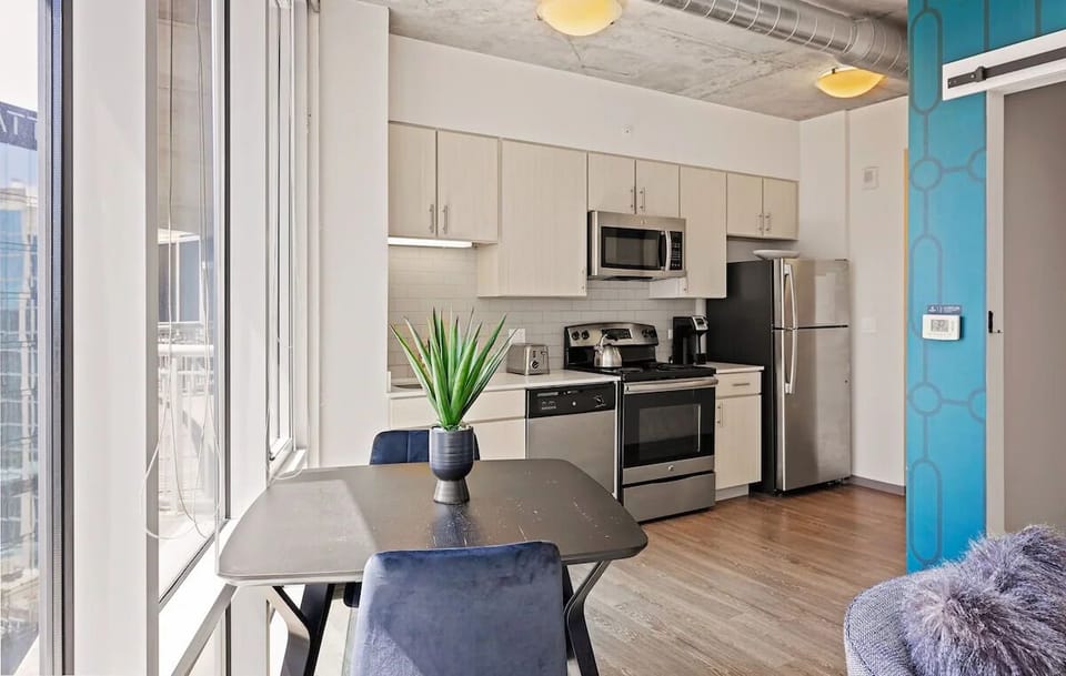 Dine by the windows, steps from a fully equipped kitchen.