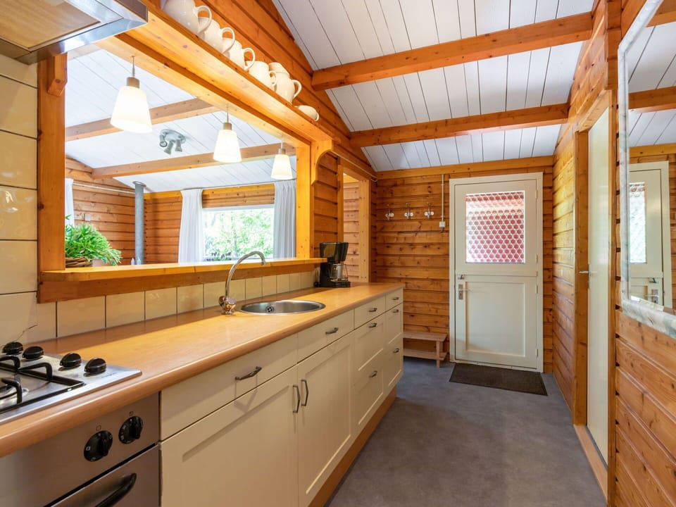 Countertop, Cabinetry, Building, Property, Window, Tap, Kitchen Sink, Sink, Houseplant, Wood