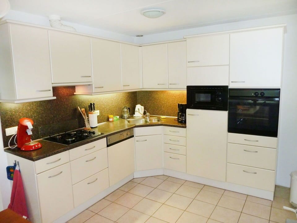 Property, Room, Cabinetry, Kitchen, Furniture, Countertop, Interior Design, Building, Yellow, Real Estate