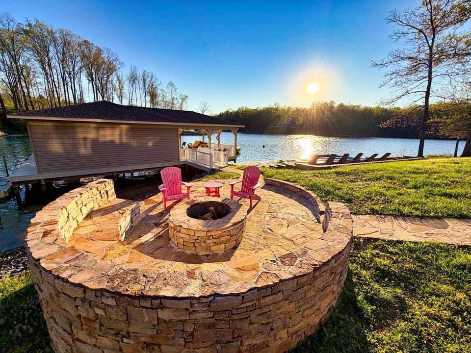 Lakeside fire pit, dock, and sunset views—relax by the water.