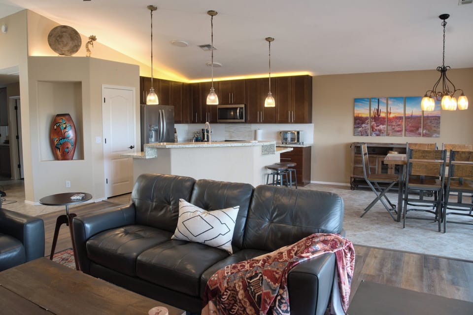 Bright, open space with fully equipped kitchen and dining table and chairs. 
