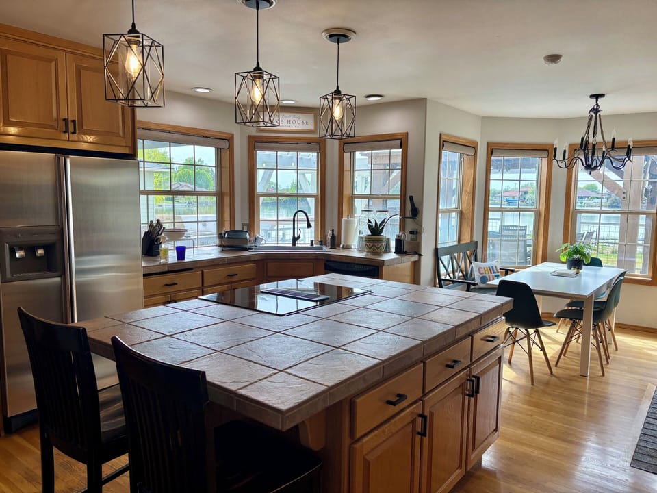 Spacious, fully stocked kitchen with dine in seating and large island