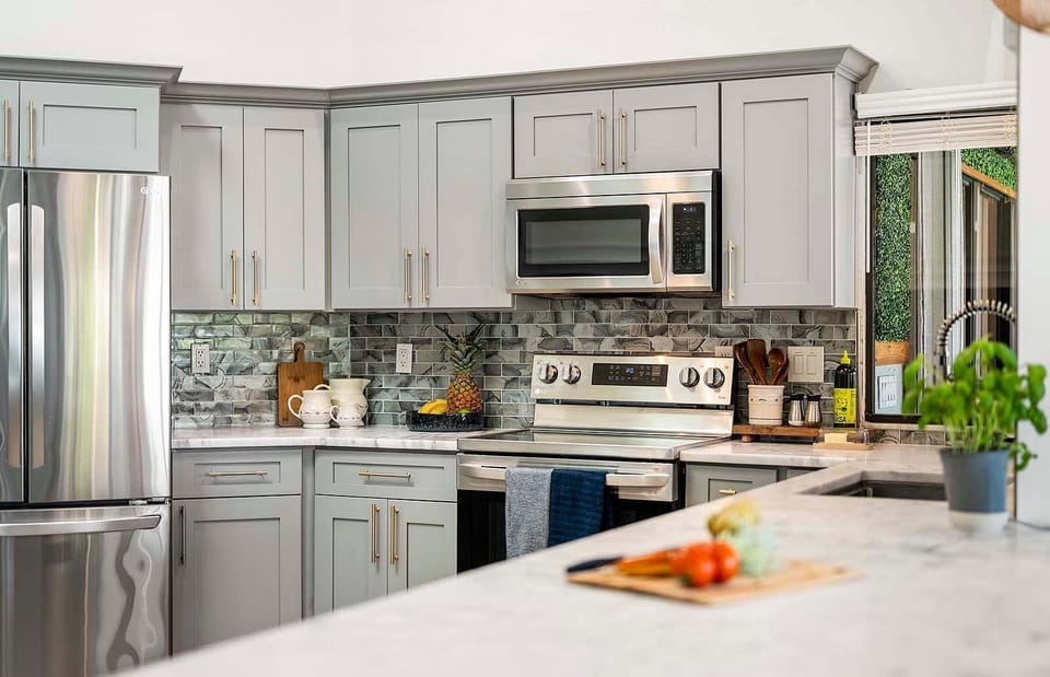 Beautifully Decorated Kitchen with Stainless Appliances