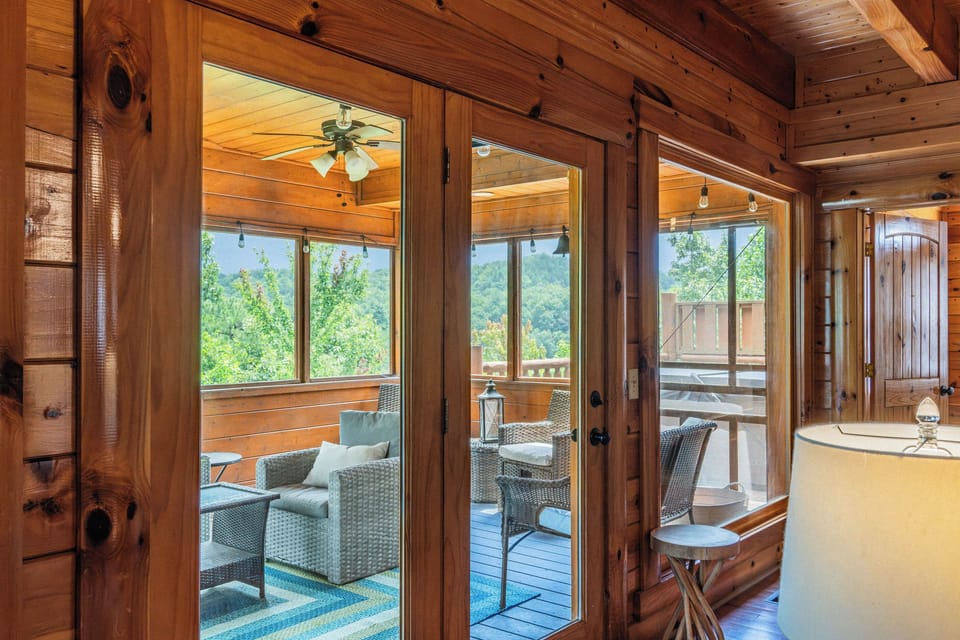 The enclosed porch flows directly from the living area, extending your space for relaxing and visiting.