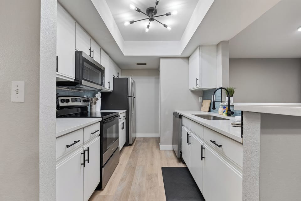 Electric stove, fully stocked kitchen with all the basics provided