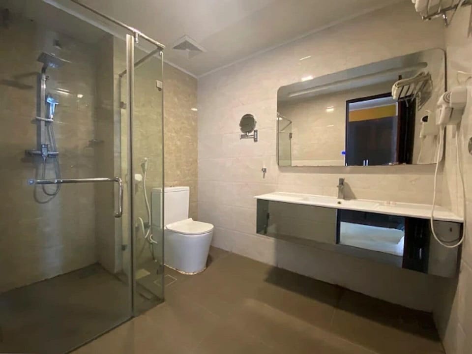 Shower, hair dryer, slippers, towels